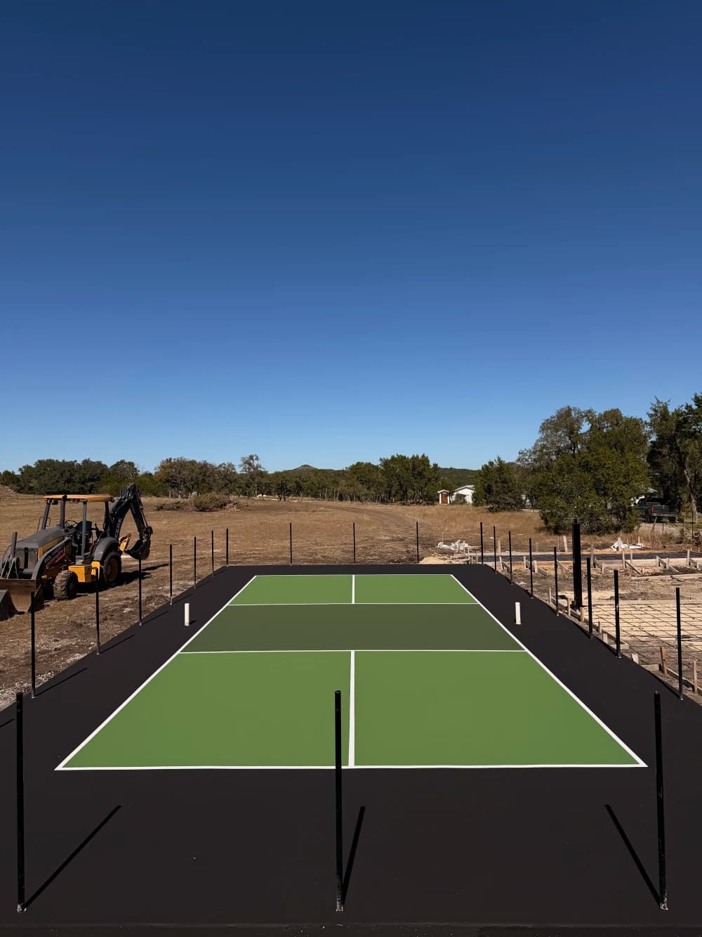 Three-color court with crisp pickleball lines after conversion